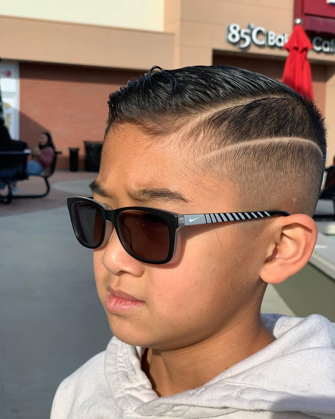 Kid's cut with hard part design and clean fade